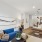 Open-concept living room with wood flooring and stylish decor